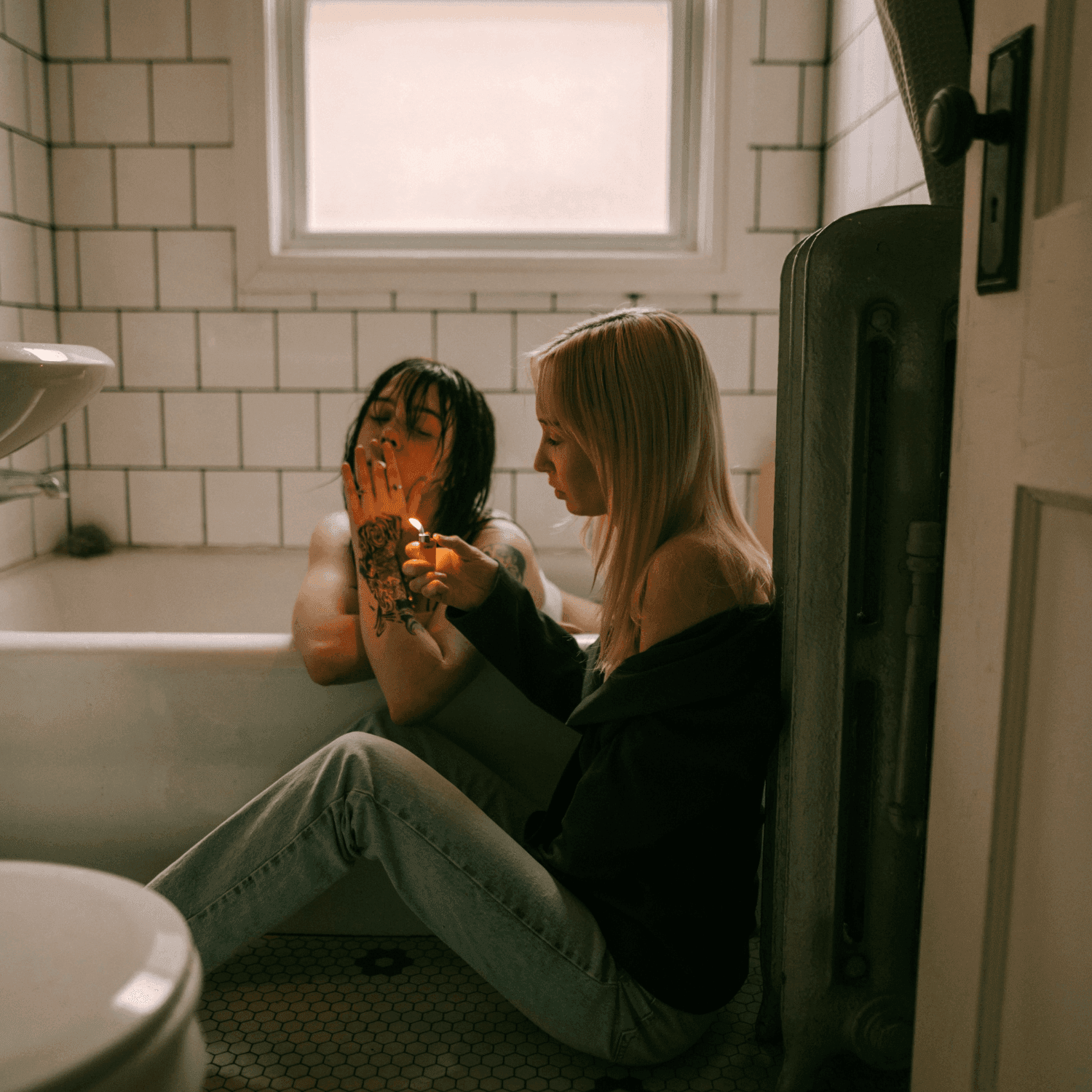2 girls smoking in bathroom
