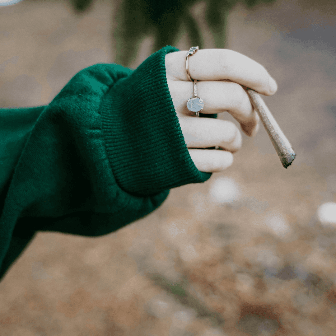 girl holding joint